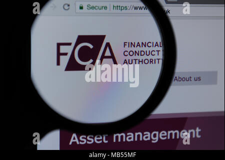 The FCA ( Financial Conduct Authority ) website seen through a magnifying glass Stock Photo