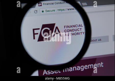 The FCA ( Financial Conduct Authority ) website seen through a magnifying glass Stock Photo