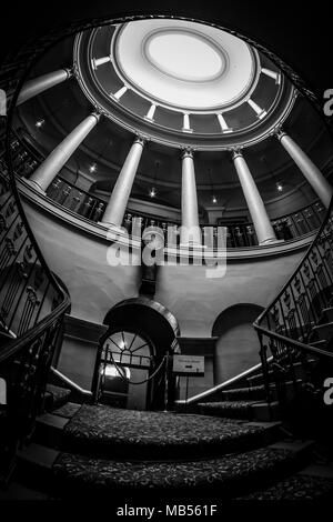 The fantastic curved staircase inside Culzean Castle located near Maybole in Ayrshire Scotland Stock Photo