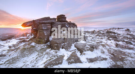 Winter snow on Belstone tor at sunrise, Dartmoor National Park Devon uk Stock Photo