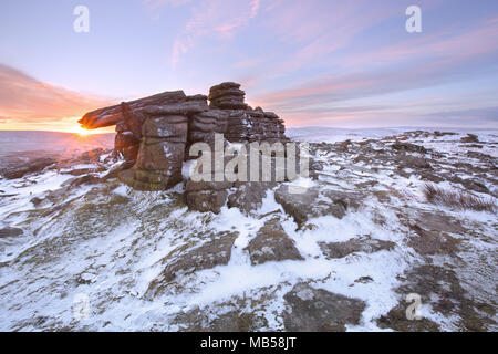 Winter snow on Belstone tor at sunrise, Dartmoor National Park Devon uk Stock Photo