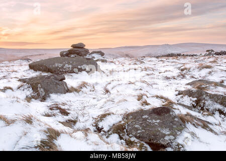 Winter snow on Belstone tor at sunrise, Dartmoor National Park Devon uk Stock Photo