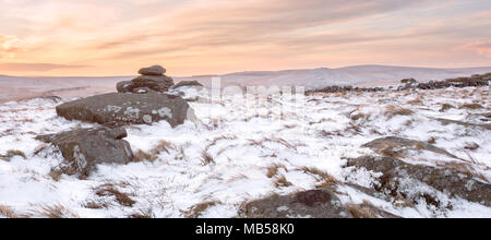 Winter snow on Belstone tor at sunrise, Dartmoor National Park Devon uk Stock Photo