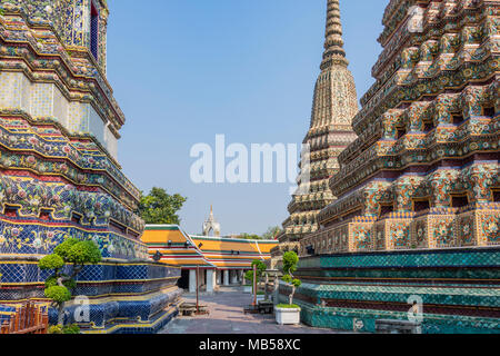 Striking and colorful buildings surround the temples in the Grand Palace of Bangkok Thailand Stock Photo