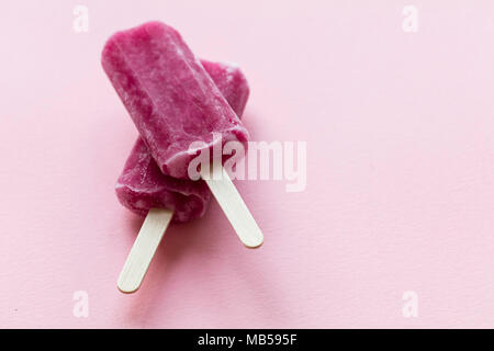 Pink Raspberry Lollies Raspberry flavour summertime ice lollies on a pink background Stock ...