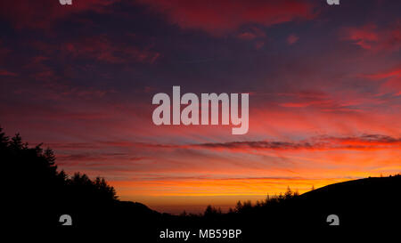 Colourful dawn skies over the Clwydian Forest, Moel Famau, North Wales Stock Photo