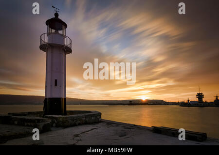 Little lighthouse at sunset in Varna, Bulgaria Stock Photo