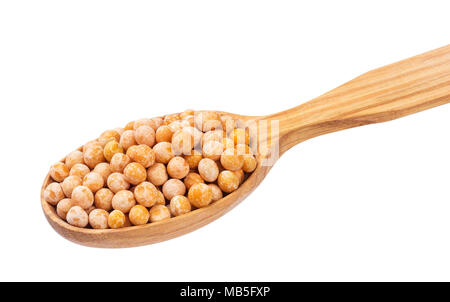 Dry peas in wooden spoon isolated on white background. Stock Photo