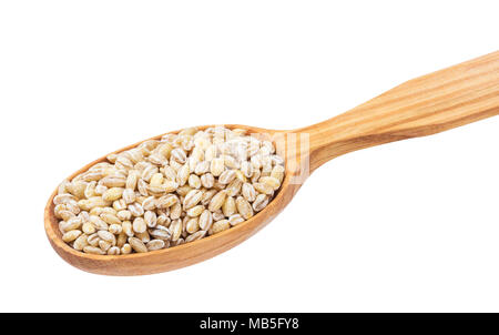 Pearl barley groats in wooden spoon isolated on white background Stock Photo