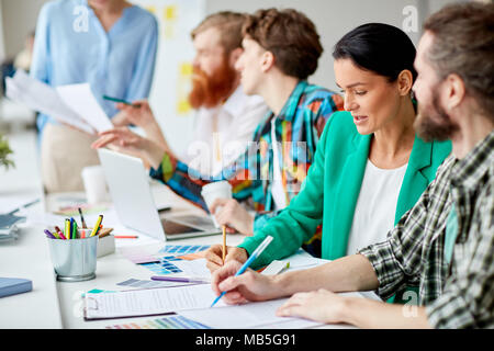 Group of creative designers working with color samples Stock Photo