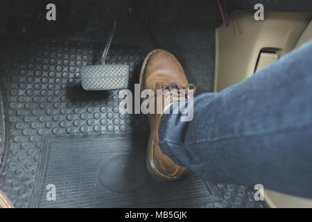 Close up Leather Shoe ob pedal in car Stock Photo