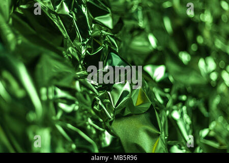 Full frame take of a sheeT of crumpled green aluminum foil background Stock Photo