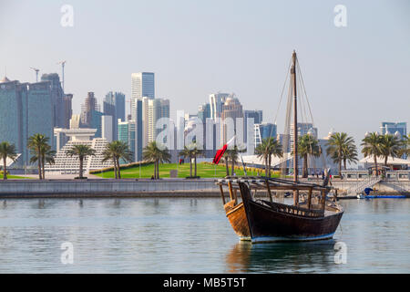 DOHA, QATAR - April 7, 2018: A traditional sailing dhow, complete with mast, moored  in the Museum Lagoon in Doha, Qatar Stock Photo