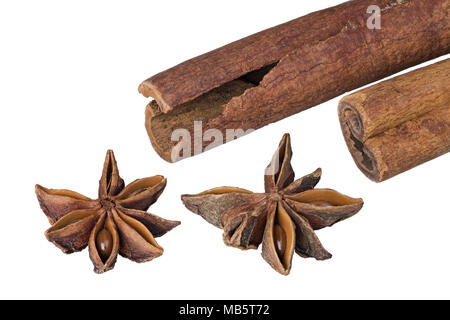 Cinnamon sticks and star anise close up. Decorative detail of aromatic Christmas seasonings. Isolated on white background. Great depth of field. Stock Photo