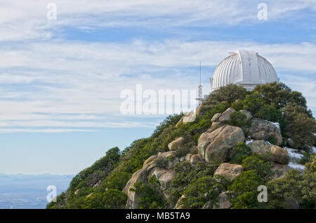 Kitt Peak is an astronomical observatory in the Sonoran Desert of Arizona on the Tohono O'odham Indian Reservation.  It has 23 optical and 2 radio Stock Photo