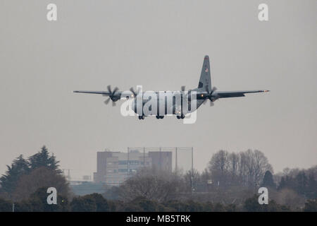 A C-130J Super Hercules approaches the runway at Yokota Air Base, Japan, Feb. 22, 2018. Yokota has received its eleventh C-130J from Lockheed Matin Aeronautics Company, Ga., as part of fleet-wide redistribution of assets set in motion by Air Mobility Command. Stock Photo