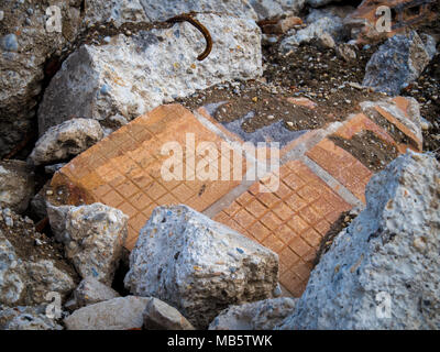 Old bricks from the demolished house. Environmental burden of wild landfill. Stock Photo