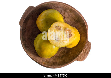 closeup of rare araza fruit from the Amazon area in rustic wood bowl isolated on white Stock Photo