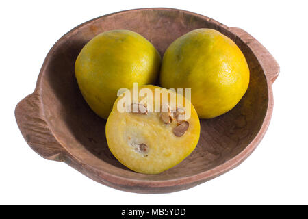 closeup of rare araza fruit from the Amazon area in rustic wood bowl isolated on white Stock Photo