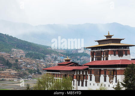 Paro Dzong (fortress) over looking the city in Bhutan. Stock Photo