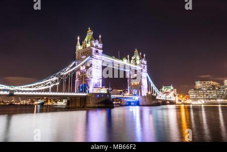 Reflection of Tower Bridge in London at night Stock Photo