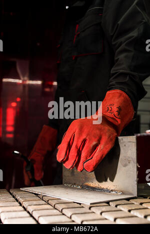 red protective leather welder gloves Stock Photo