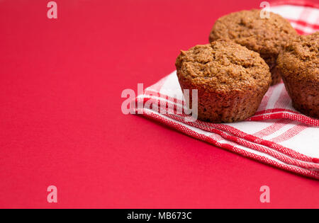 Apple Cinnamon Pecan Muffins on an Apple Red Background Stock Photo