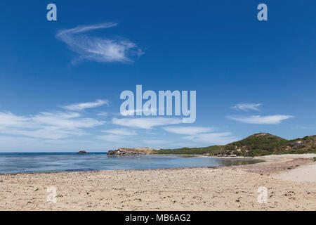 Wisps of cloud against a clear blue sky above Penguin Island, Rockingham, Western Australia Stock Photo