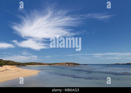 Wisps of cloud against a clear blue sky above Penguin Island, Rockingham, Western Australia Stock Photo