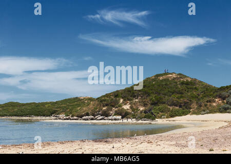 Wisps of cloud against a clear blue sky above Penguin Island, Rockingham, Western Australia Stock Photo