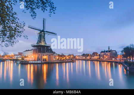 Windmill De Adriaan reflected in river Spaarne Haarlem North Holland The Netherlands Stock Photo