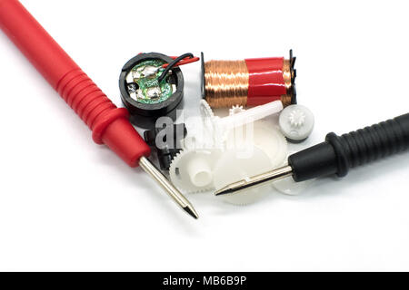 Two Meter Tester Probes & some Old Clock Parts Isolated on a white background Stock Photo