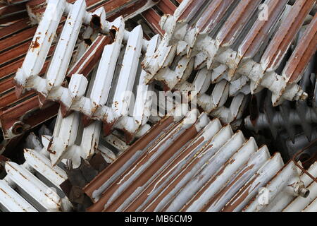 Old and rusty radiators piled up in a junkyard Stock Photo