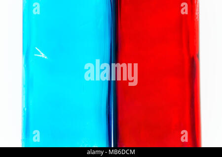 Blue and red glass on white background surface. Glass a little bit wet and dirty Stock Photo