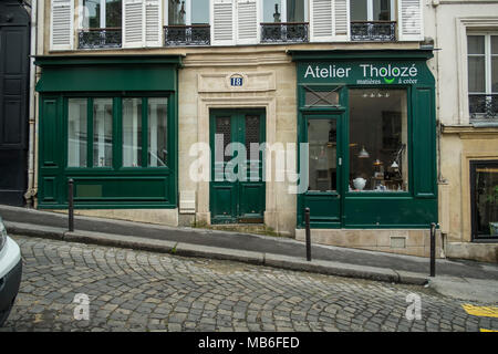The gorgeous green of a store in Rue Tholoze, Paris Stock Photo