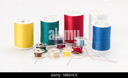 Many different kinds of thread used in sweing on spools Stock Photo