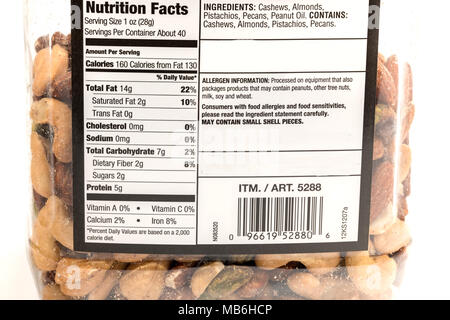 Boise, ID, USA - March 17, 2018: Nutrition facts label on a jar of  assorted nuts Stock Photo
