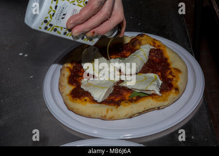 Pizza Margherita with fresh mozzarella cheese and tomato sauce Stock Photo