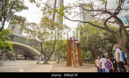 MANILA, PHILIPPINES - NOVEMBER 28, 2017: Ayala Triangle in Makati City, Metro Manila, Philippines. Metro Manila is one of the biggest urban areas in the world with 24 million people. Stock Photo