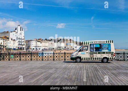 HASTINGS, UK - APRIL 5th, 2018: Ice cream van is selling ice creams on sunny day on pier in Hastings, East Sussex. Stock Photo