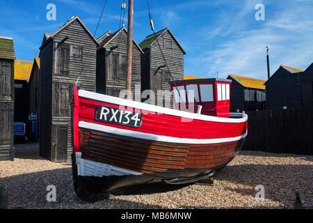HASTINGS, UK - APRIL 5th, 2018: Boats and net shops in  Hastings, East Sussex. Traditional storage buildings of the Hastings fishing fleet were used i Stock Photo