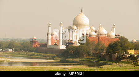 View of the Taj Mahal through the haze from Agra Fort. The Agra fort is a UNESCO World Heritage site. Stock Photo