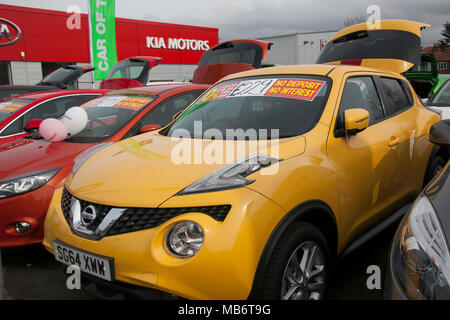 Motor dealer forecourt; Second hand used cars for sale, for low monthly rental at Suzuki dealership, Southport, UK Stock Photo