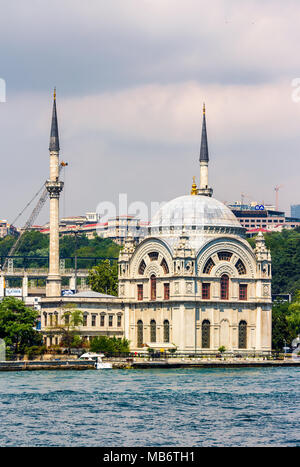ISTANBUL, TURKEY - AUGUST 18, 2015: Ortakoy Mosque infront of the cityscape, view from the other side of Bosphorus in Istanbul Stock Photo
