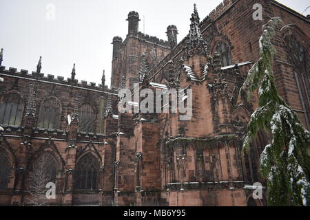 Chester's Anglican cathedral battling the elements on a snowy winters morning Stock Photo