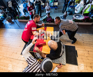07 April 2018, Germany, Rodenbach: Dennis Busch (L) from Hannover meeting Artem Kaloev from Berlin in the championship. The two referees are observing the two athletes. Around 100 athletes are taking part in the 31st championship. Photo: Andreas Arnold/dpa Stock Photo
