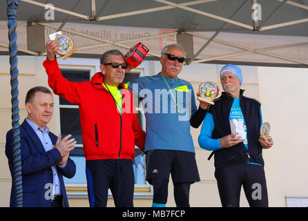 Checiny, Poland, 7th April, 2018. The winners on the podium. CROSSRUN, amateur running competition. This competition is divided into two categories: 10 km and 21.5 km. Credit: Pawel Burgiel/Alamy Live News. Stock Photo