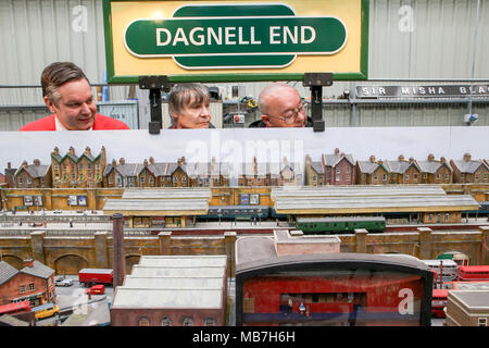 Model railway enthusiasts enjoying their model railway layouts Stock Photo