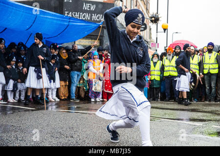 Southall, UK. 8th April, 2018. A Sikh martial arts display during the Vaisakhi Nagar Kirtan procession from the Havelock Road Gurdwara to the Park Avenue Gurdwara. Vaisakhi, which will be celebrated on 14th April, is the holiest day in the Sikh calendar, a harvest festival marking the creation of the community of initiated Sikhs known as the Khalsa. Credit: Mark Kerrison/Alamy Live News Stock Photo