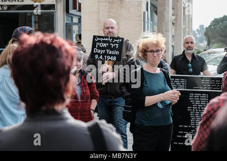Jerusalem, Israel. 8th April, 2018. Jews and Arabs march together in a procession carrying plaques bearing the names of the victims of the Deir Yassin Massacre, under tight police protection, to the few remaining structures of the 1948 Arab village invaded and destroyed. Commemoration organized by Zochrot (Remembering), seeking to raise public awareness of the Palestinian Nakba (Catastrophe). Credit: Nir Alon/Alamy Live News Stock Photo